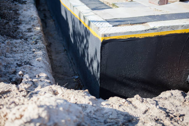Professional Basement Waterproofing technician working in Senoia, GA
